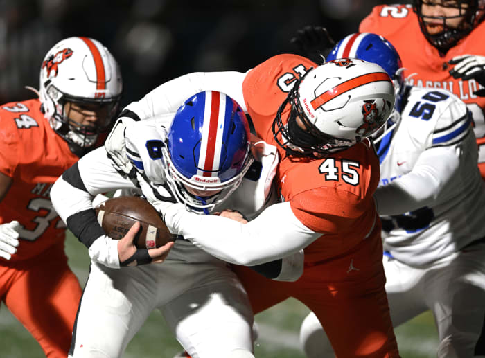 Massillon's Mike Wright, Jr. (No. 45) makes a tackle during the 2022 regional finals against Lake. Photo credit: Jeff Harwell, SBLive Sports